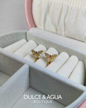 Topos de mariposas doradas con circones